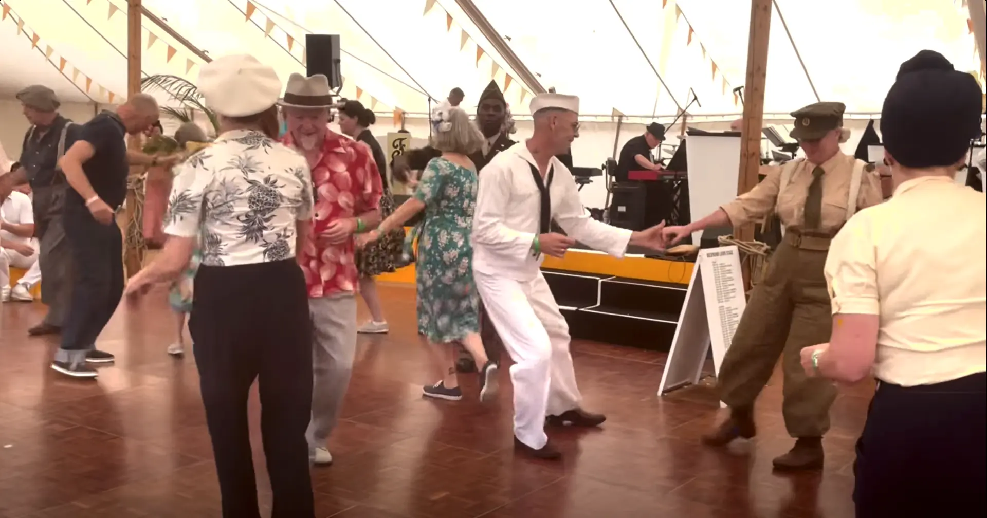 Dancers in period clothes enjoying a social swing dance at Goodwood Revival